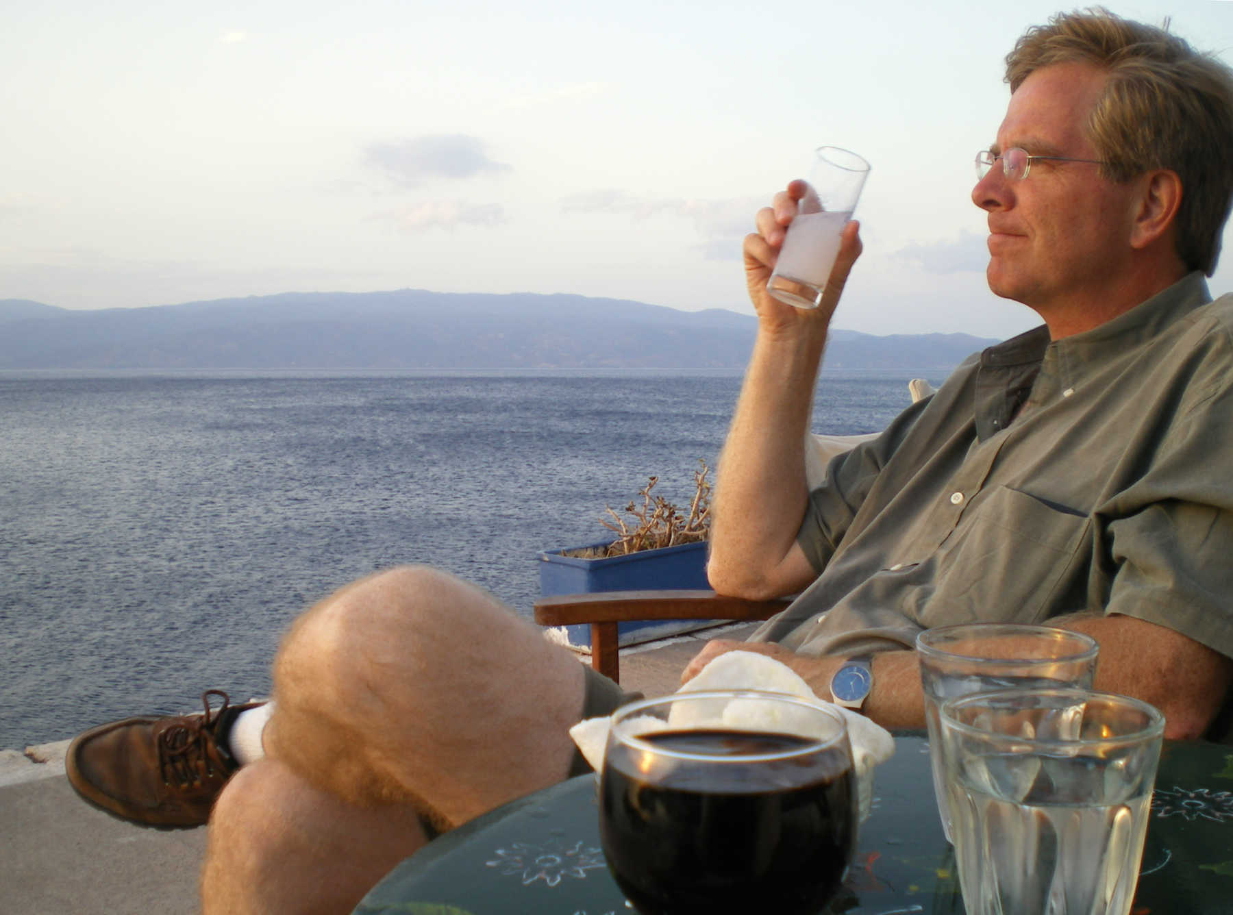 Rick Drinking Ouzo, Hydra, Greece