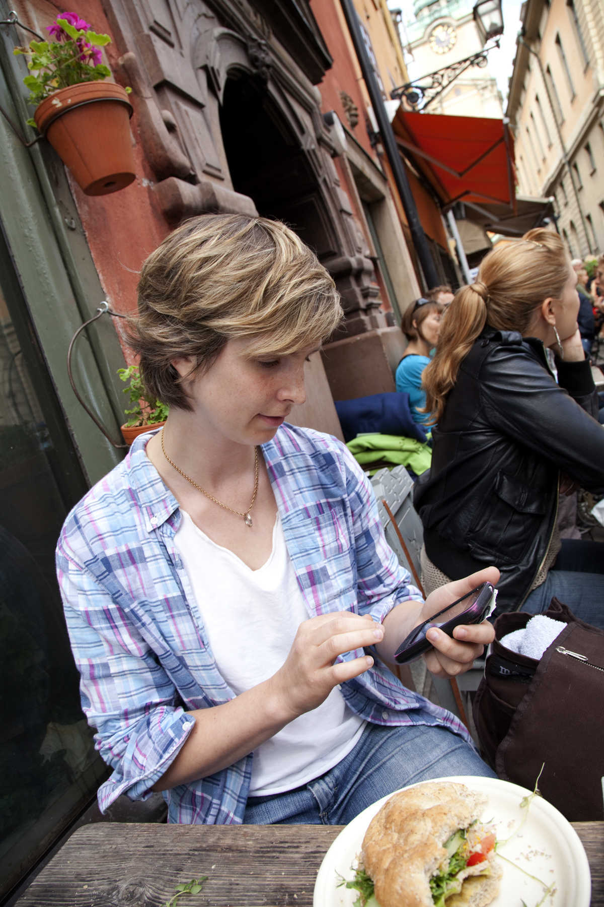 Traveler with iPhone, Stockholm, Sweden