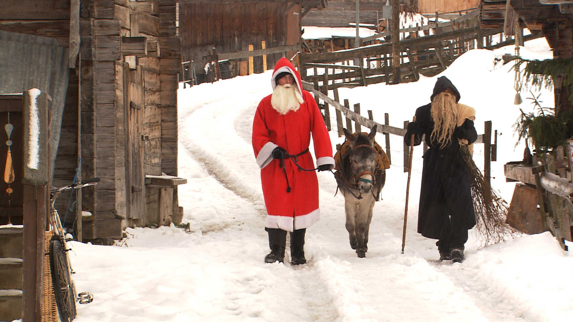 Samichlaus and Schmutzli make the rounds in the Alps