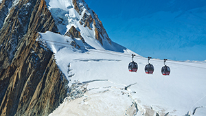 Gondolas dangling over a glacier near France's Mont Blanc