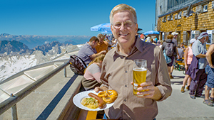Rick enjoying a high-altitude lunch of wurst and beer atop the Zugspitze, on the German-Austrian border