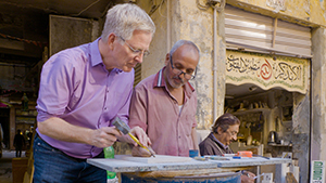 A Cairo artisan giving Rick a hands-on lesson in tombstone engraving