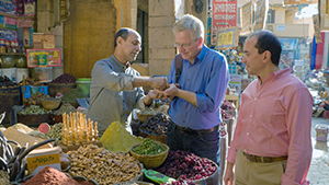 Rick sampling nibbles in the market in Luxor, Egypt